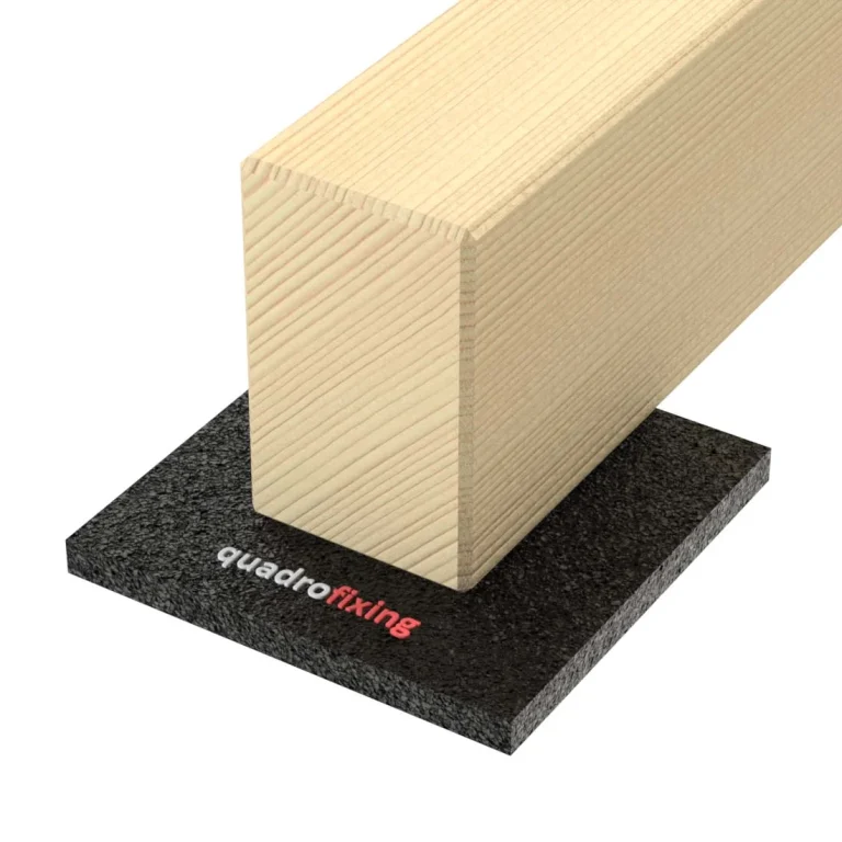 Timber decking joist supported on a rubber QUADRO PAD
