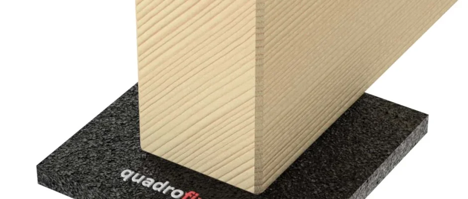 Timber decking joist supported on a rubber QUADRO PAD