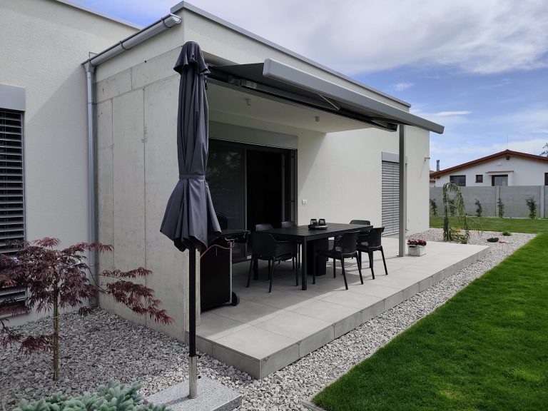 Raised patio with matching paving along the edge