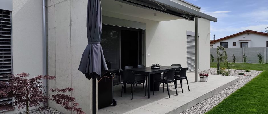 Raised patio with matching paving along the edge